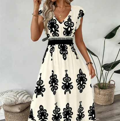 Elegantti V-aukkoinen mekko barokkikuviolla
